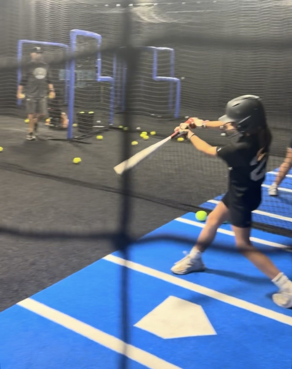 Real pitching — batting cage at Hitterz Lab