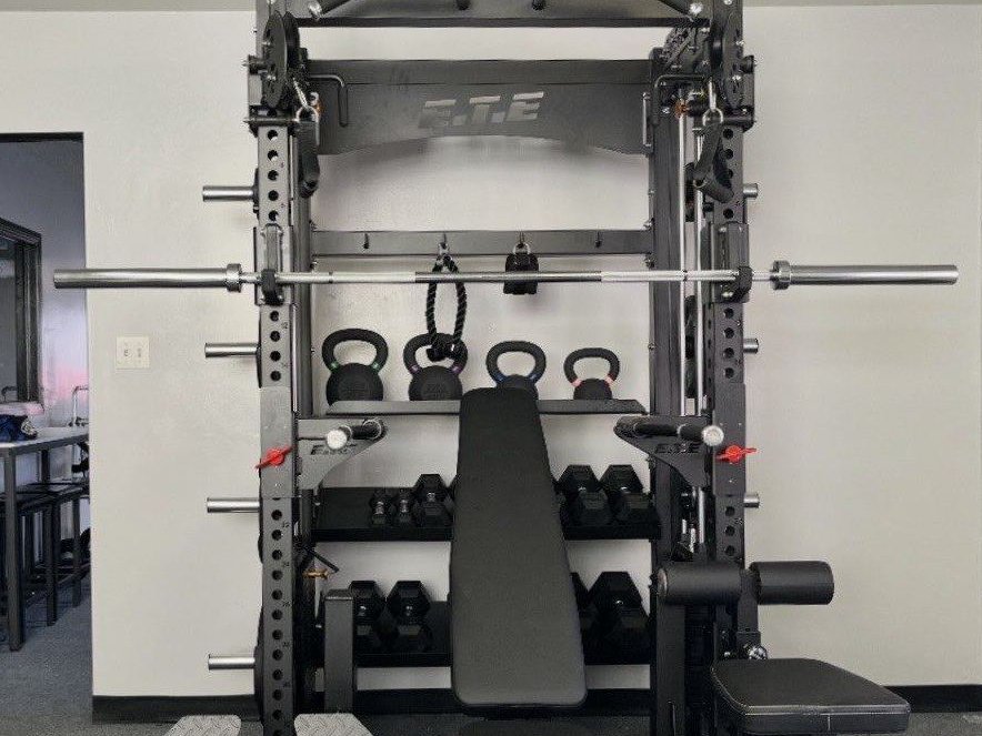 On-site weight room with rack, bench and free weights